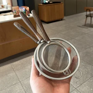 Stainless steel colander with wooden handle